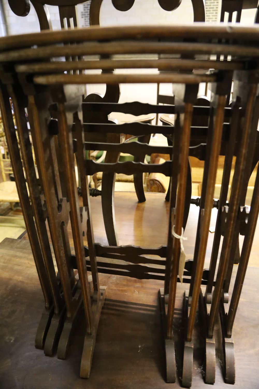 A quartetto of Edwardian oval mahogany tea tables, width 51cm, depth 34cm, height 64cm